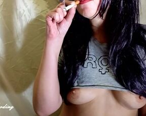 Alice in sexy T-shirt smokes a marijuana cigarette before having sex with a new stud