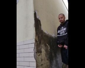 dude freeing a lot of pee in a wall