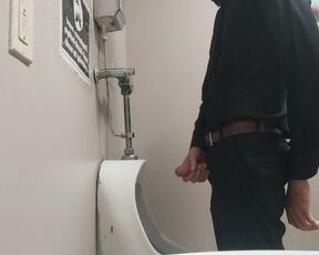 Pissing at public urinal and jerk off before someone comes in