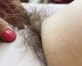 Hairy pussy in white swimsuit closeup